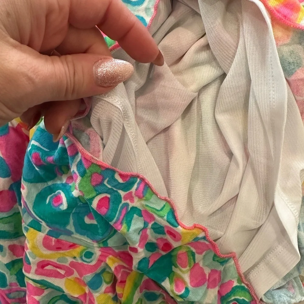 Lilly Pulitzer Vibrant Pink and Green romper.